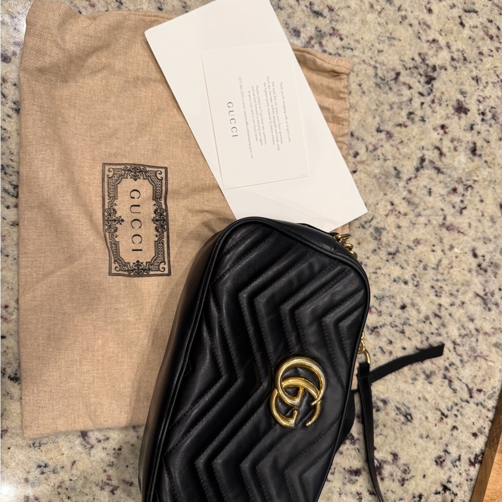 Gucci Black Leather Clutch with Gold Accent